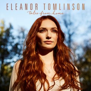 ELEANOR TOMLINSON ANNOUNCES RELEASE DATE FOR DEBUT ALBUM 'TALES FROM HOME'